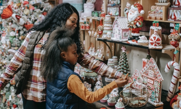person and child browing holiday decor in a store