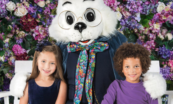 giant bunny with two children standing by their side