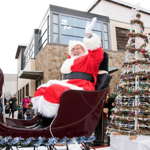 santa clause waving from a sleigh