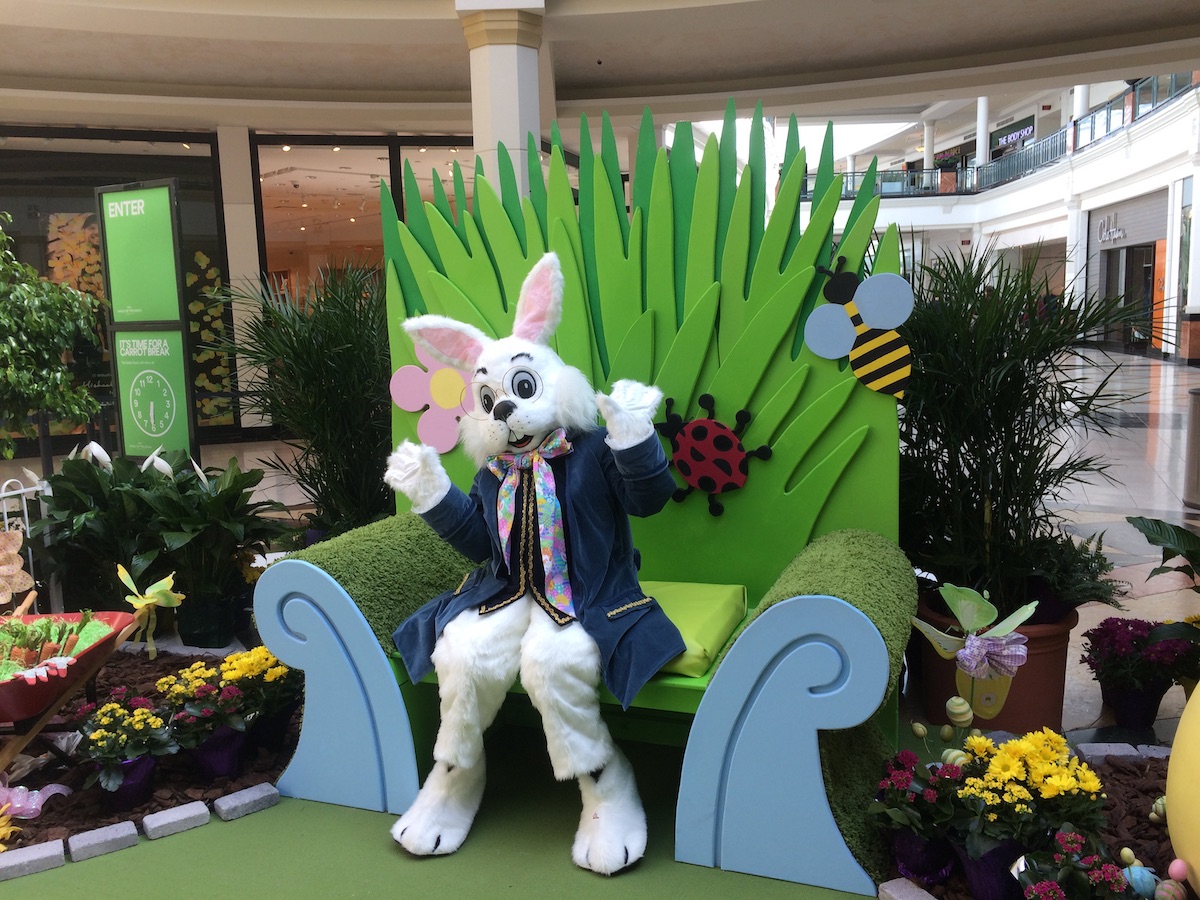 Easter bunny sitting on a chair in a photo op