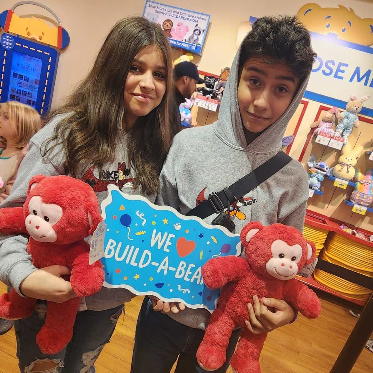 two children holding teddy bears