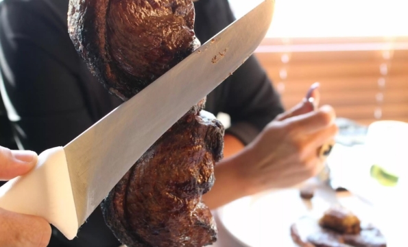 a knife touching meat