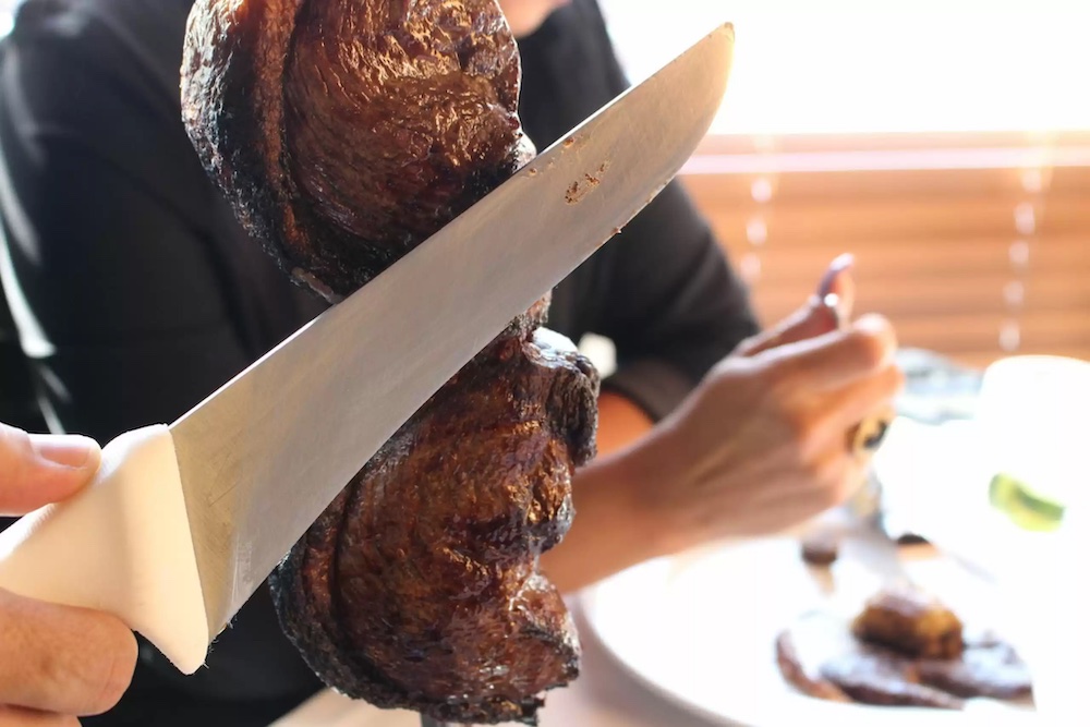 a knife touching meat